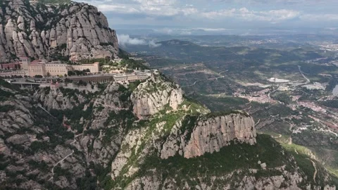 Aerial drone view of ancient mountain monastery in rugged landscapes Stock Footage 321346001