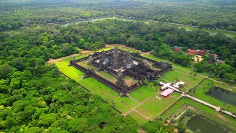 Aerial Drone View of Angkor Wat Temple Complex Surrounded by Tropical Forest Stock Footage 339324257