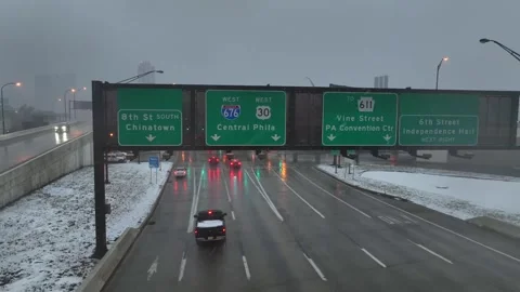 Aerial drone view approaching highway traffic signs over wet roadway in Vídeo Stock 331959556