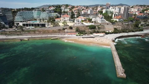 Aerial drone view approaching people at Moitas beach in Cascais, Portugal Stock Footage 238770268