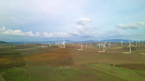 Aerial drone view approaching wind mill turbine farm Stock Footage 293064148