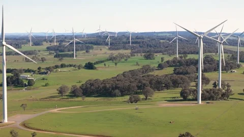 Aerial drone view of an array of large wind turbines at Bannister, NSW Stock Footage 288774519