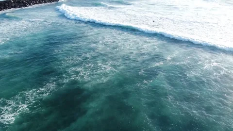 Aerial drone view of Atlantic Ocean coast with surfers in the water. Big waves Video stock 258799984