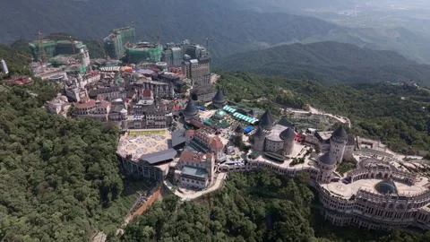 Aerial Drone View of Ba Na Hills SunWorld Resort Surrounded by Forest in Vietnam Stock Footage 339226946