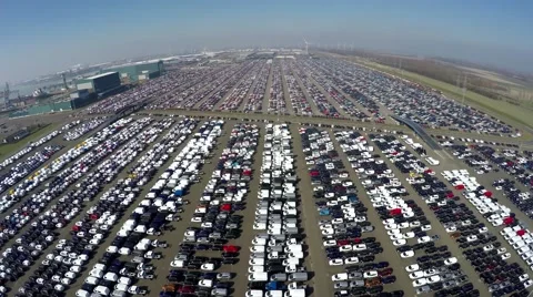 Aerial drone view backwards fast fly over new car storage parking lot 4k Stock Footage 61249094