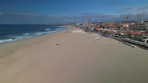 Aerial drone view of beach in Espinho, Aveiro region, Portugal on a sunny day Stock Footage 283764554
