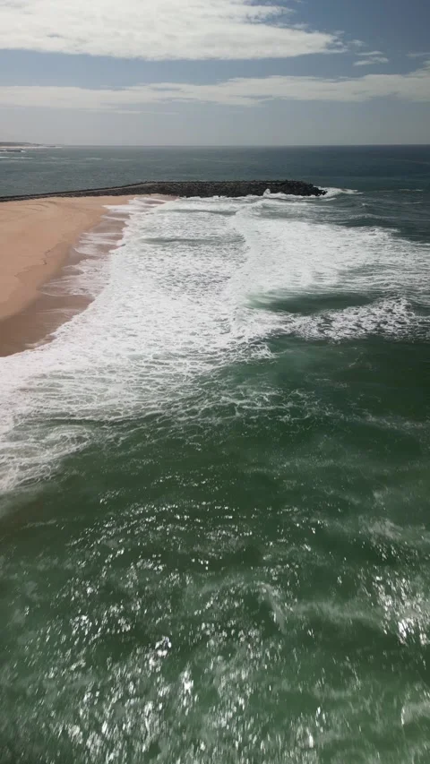 Aerial drone view of beach in Espinho, Aveiro region, Portugal on a sunny day Stock Footage 283766523