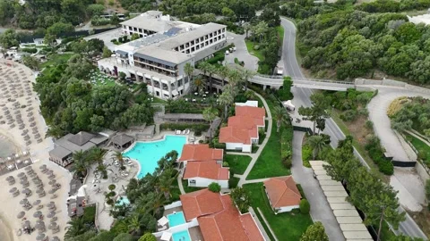 Aerial drone view of beach resort with umbrellas and turquoise sea, Halkidiki Stock Footage 327654057