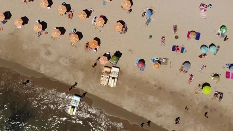 Aerial drone view of beach, umbrellas, and hotels in Varna, Bulgaria Stock Footage 276192022