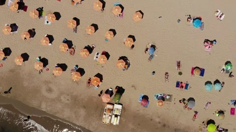 Aerial drone view of beach, umbrellas, and hotels in Varna, Bulgaria Stock Footage 276192076