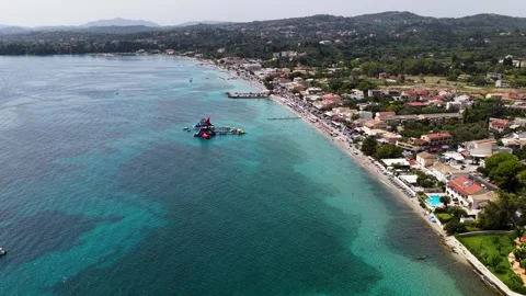 Aerial drone view of beautiful Ipsos beach coastline in Corfu Greece with clear Stock Footage 346025780