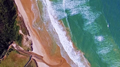 Aerial drone view of beautiful waves coming to sand beach Stock Footage 71312181