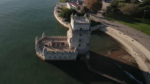 Aerial drone view of Belem Tower overlooking the Tagus River in Lisbon, Portugal Stock Footage 221264843