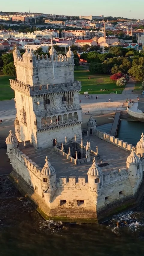 Aerial drone view of Belem Tower on the bank of the Tagus River at sunset. Stock Footage 344584358