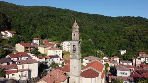 Aerial drone view of bell tower with tolling bell in Alpe mountain village Stock Footage 247837327