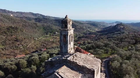 Aerial drone view of bell tower of abandoned church called Chiesa di Sant'Andrea Stock Footage 247837377