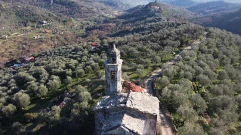 Aerial drone view of bell tower of abandoned church called Chiesa di Sant'Andrea Stock Footage 247837412