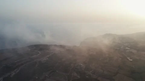 Aerial drone view between the clouds, sunset time. Sea, cliffs. Malta island Stock Footage 274204973