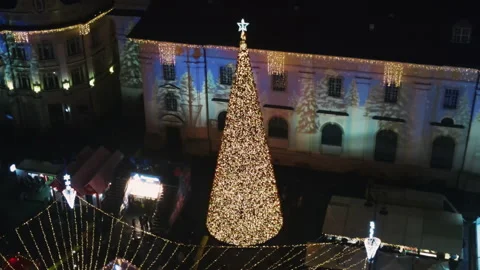 Aerial drone view of The Big Square in Sibiu at night, Romania. Old city centre Stock Footage 168623132