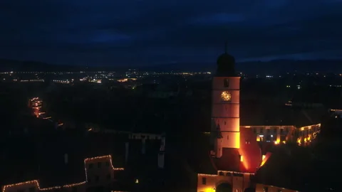 Aerial drone view of The Big Square in Sibiu at night, Romania. Old city centre Stock Footage 168626937