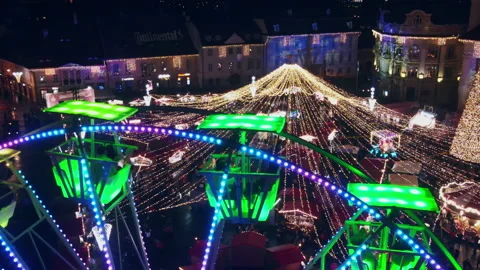 Aerial drone view of The Big Square in Sibiu at night, Romania. Old city centre Stock Footage 168628134