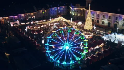 Aerial drone view of The Big Square in Sibiu at night, Romania. Old city centre Stock Footage 168628323