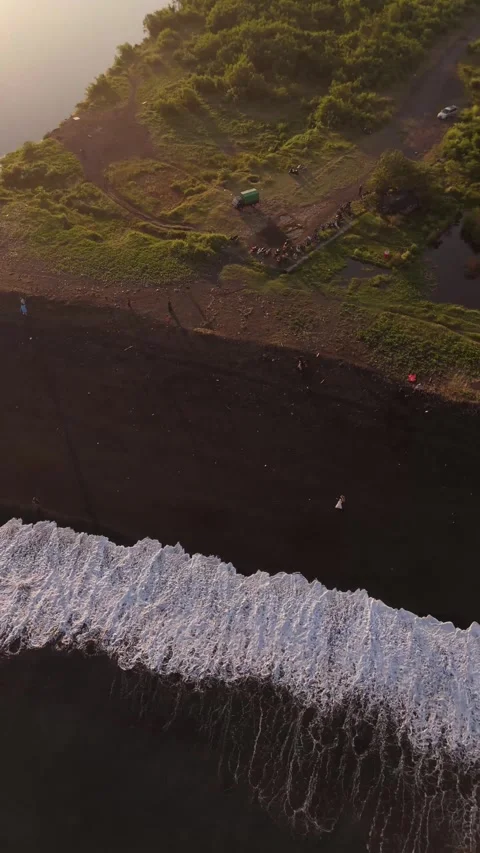 Aerial Drone View of Black Sand Beach and Green Coastline, East Bali, Indonesia Video stock 337229628