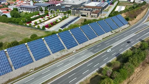Aerial Drone view of Blue Solar panel farm installed on the slopes of a highway Stock Footage 209140621