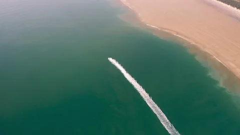 Aerial drone view of boat approaching tenby bay beach during a summer day. Stock Footage 171761860