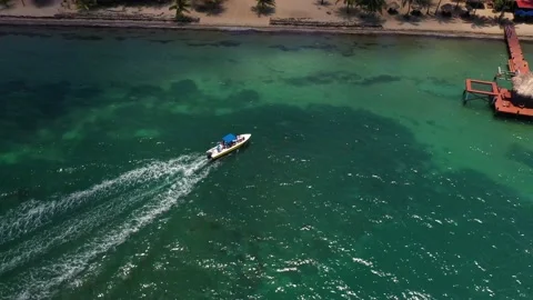 Aerial Drone View of Boat Docking at Caribbean Beach in Belize Stock Footage 197176910