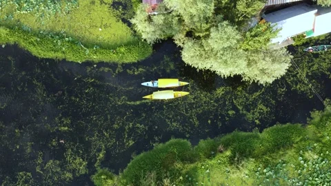 Aerial drone view of boats navigating the lifeline lanes of Dal Lake. Stock Footage 310786233