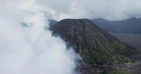 Aerial Drone View of Bromo Volcano Crater with Fog and Mountain Landscape Stock-Footage 333844600