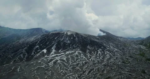 Aerial Drone View of Bromo Volcano Crater with Thick Fog and Mountain Landscape 스톡 동영상 333844737
