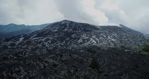 Aerial Drone View of Bromo Volcano Crater with Dense Fog and Mountain Landscape Stock Footage 333845818