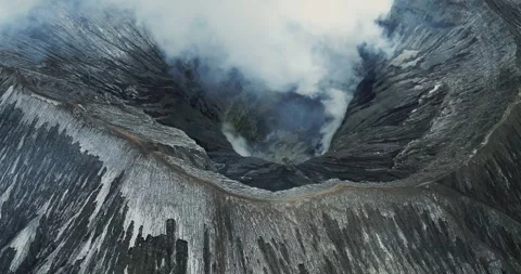 Aerial Drone View of Bromo Volcano Crater with Foggy Mountain Landscape Stock-Footage 333898654