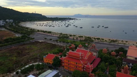 Aerial drone view of Buddhist temple and fishing boats in Da Nang Bay Stock Footage 340597559
