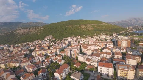 Aerial Drone View of Budva Cityscape with Mountains and Adriatic Coastline 4K Stock Footage 294815417