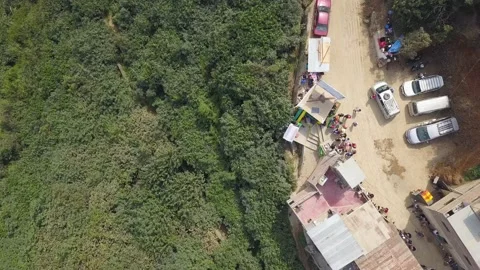 Aerial drone view of a cable car ride as a tourist attraction in a village betwe Stock Footage 198778193
