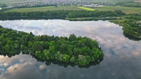 Aerial drone view of calm forest lake. Clouds sky reflected in the water. Near Stock Footage 201465320