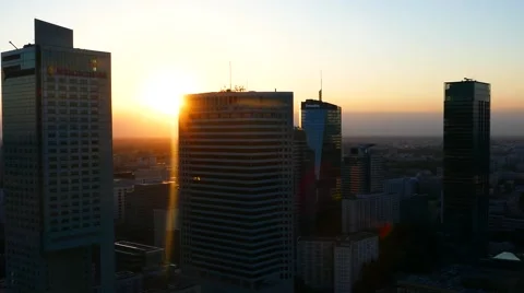 Aerial drone view camera moving between buildings and skyscrapers during sunset Stock Footage 68402800