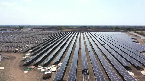 Aerial drone view camera showing sun rays falling on solar panels Stock Footage 263810291