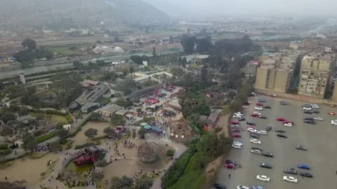 Aerial drone view of a camera zooming out of the Huachipa zoo in the cloudy day 動画素材 158337671