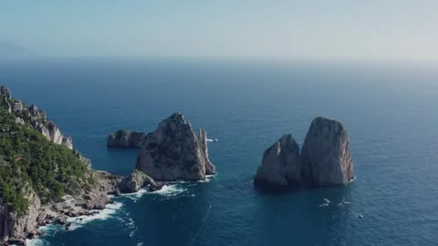 Aerial Drone View of Capri Cliffs (Faraglioni di Mezzo) by the Mediterranean Stock Footage 330855279