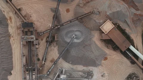 An aerial drone view captures the vast operations of an industrial gravel and Stock Footage 342701006