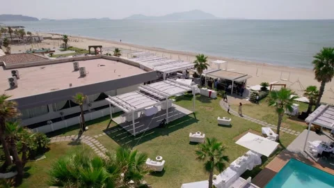 Aerial drone view captures the vibrant evening atmosphere of a Mediterranean. Stock Footage 265843603