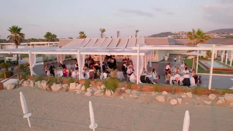 Aerial drone view captures the vibrant evening atmosphere of a Mediterranean. Stock Footage 265844223