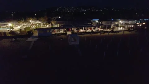 Aerial drone view captures the vibrant evening atmosphere of a Mediterranean. Stock Footage 265844681