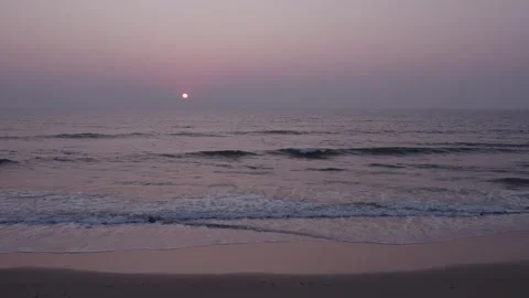 Aerial drone view capturing a breathtaking sunset over the calm waves of th.. Stock Footage 340967192