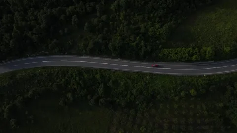 Aerial Drone View Car Driving on Curvy Mountain asphalt Road in summer Stock Footage 244492620