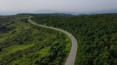 Aerial Drone View Car Driving on Curvy Mountain asphalt Road in summer 스톡 동영상 244492647
